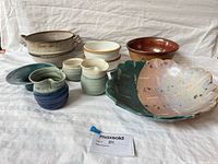 All nine stoneware pieces grouped