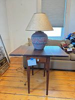 Full view of table with both leaves extended and lamp on top