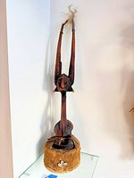 Full view of hardwood tribal sculpture on base