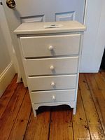 front view of white 4-drawer chest