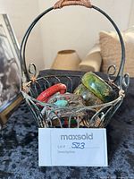 All bracelets in wire basket overview