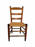Front view of oak ladder-back chair with rush seat