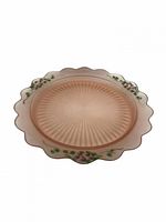 Top view of pink satin scalloped serving plate with floral rim