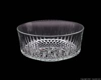 Side view of clear pressed glass bowl showing vertical panel pattern