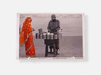 Front of photograph showing street scene with hand colouring