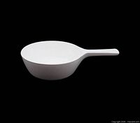 Side profile of white Corning Ware menuette pan showing handle and bowl