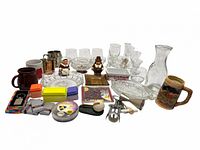 Full lot view showing glassware, mugs, figurines, bar tools and accessories