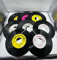 Eight 45 RPM records shown, labels include Peter Pan, Playhour and Book and Record