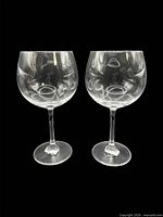 Front view of both clear Stölzle crystal wine goblets