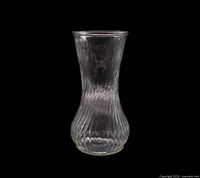 Full front view of clear ribbed swirl pressed glass vase