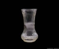 Full front view of clear ribbed swirl glass vase