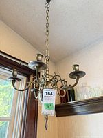 Full view of chandelier hanging from chain