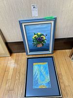 Both framed paintings, one upright still life, one flat abstract