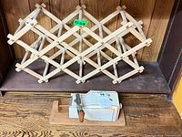 Wine rack and coffee grinder on shelf