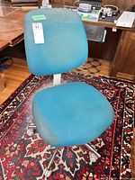 Full view of teal fabric office chair front