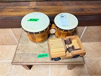 Stool top with bongos and toy truck
