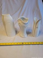 Front view of all three porcelain vases