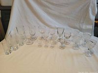 Full group of mixed glasses on table