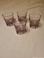 Group view of four amethyst whiskey tumblers