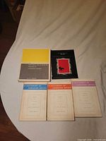 All five books laid out, covers visible