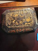 Top view showing painted lid design and overall shape