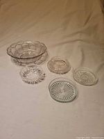 All five clear glass pieces laid out