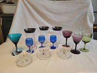 All 13 glasses arranged showing variety of colours and styles