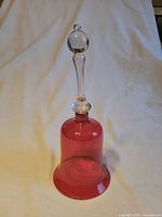Front view of cranberry glass bell