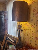 Full view of bronze lamp with cylindrical shade