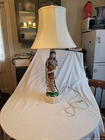 Full view of lamp with shade, cord visible