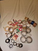 Wide view of all assorted tape rolls spread on cloth