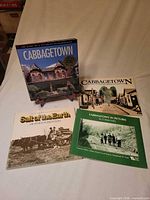 Front covers of the four books showing titles and condition