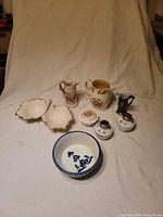 Full view of all eight ceramic pieces arranged together