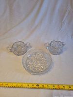 Overall view of three crystal pieces with measuring tape