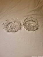 Both pressed glass bowls side by side