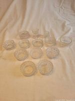 Group view of all 13 pressed glass salt cellars