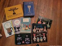All nine glass reference books laid out showing covers
