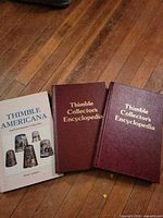 Front covers of three thimble reference books