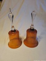 Front view of both amber glass bells showing overall form