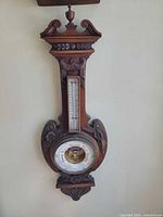 Full view of carved wood wall barometer