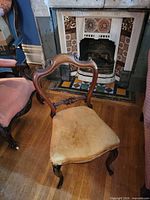 Front view of carved Victorian dining chair