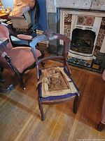 Full view of chair showing missing seat and overall frame