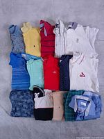 All 15 folded shirts laid out in rows