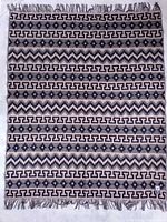 Full view of blanket showing pattern and fringe