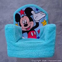 Front view of turquoise plush foam chair with Mickey Mouse graphic