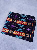 Folded blanket showing edge binding and pattern