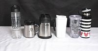 Front view of all six beverage containers side by side