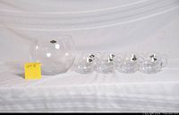 Punch bowl and five of the cups displayed together