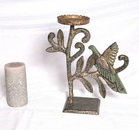 Front view of metal bird branch candle holder with included pillar candle