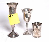 front view of three silver-plated pieces